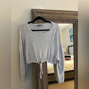 Gray cropped knit sweater with tie in the front. Size S.